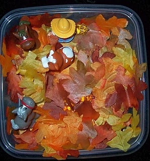 Use plastic leaves in fall colors to create a fantastic seasonal sensory bin.