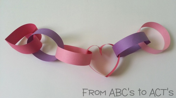 Valentine crafts for kids completing the paper heart chain