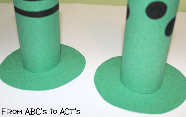 Glue the circles onto the bottom of your leprechaun hats.