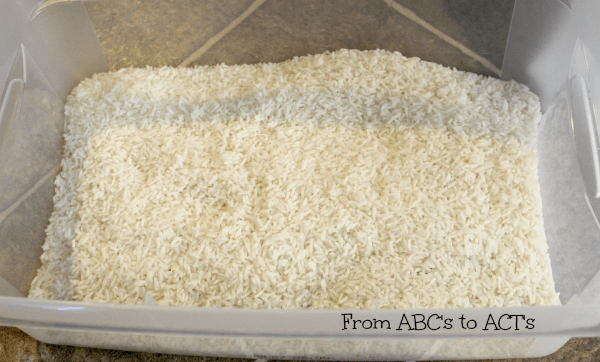 Cover all of the items with rice to hide them.
