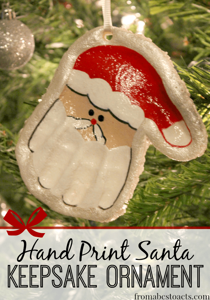 A gorgeous keepsake ornament that is sure to brighten up any tree! Even better, your little ones are going to love making a hand print Santa!