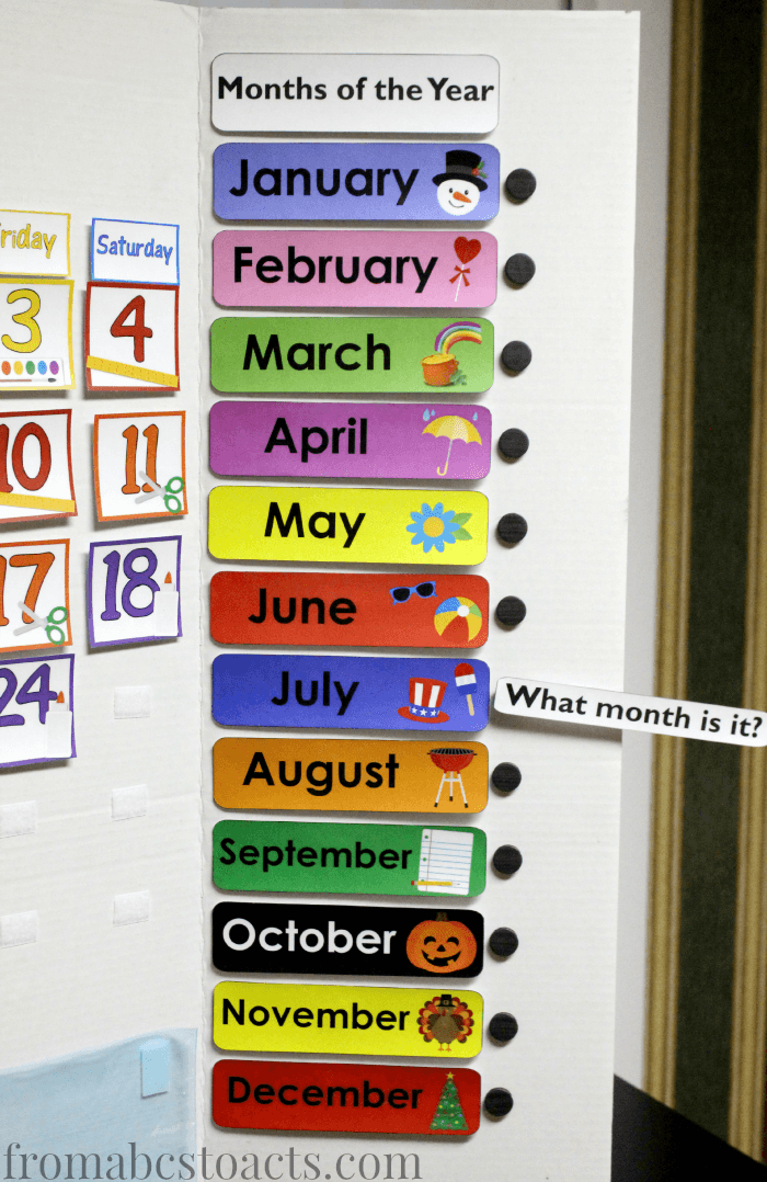 Learning the months of the year with a home preschool calendar board.